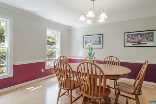 a bathroom with a granite countertop sink mirror vanity and toilet