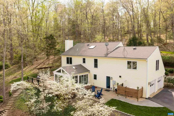 aerial view of a house with a yard