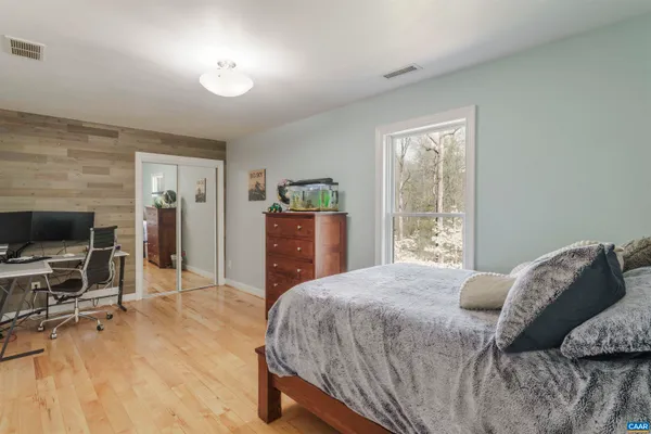 a bedroom with a bed and furniture