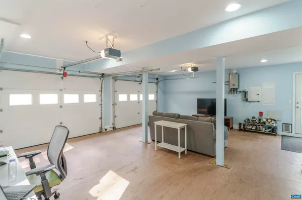 a backyard of a house with a fountain and trees