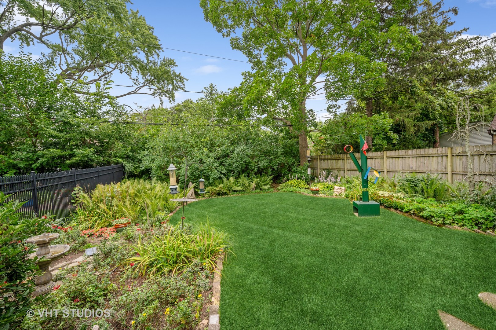 727 Hunter Road Glenview, IL 60025 - Photo 19 of 27 a garden with trees in front of it