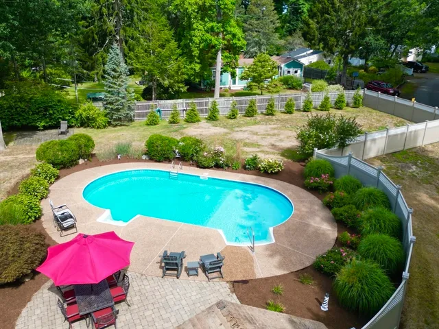 an aerial view of a house with outdoor space