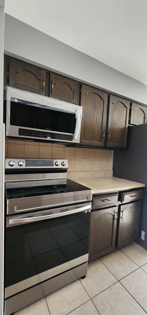 7730 Dempster Street, Unit 209 Morton Grove, IL 60053 - Photo 20 of 32 a close view of stove top oven