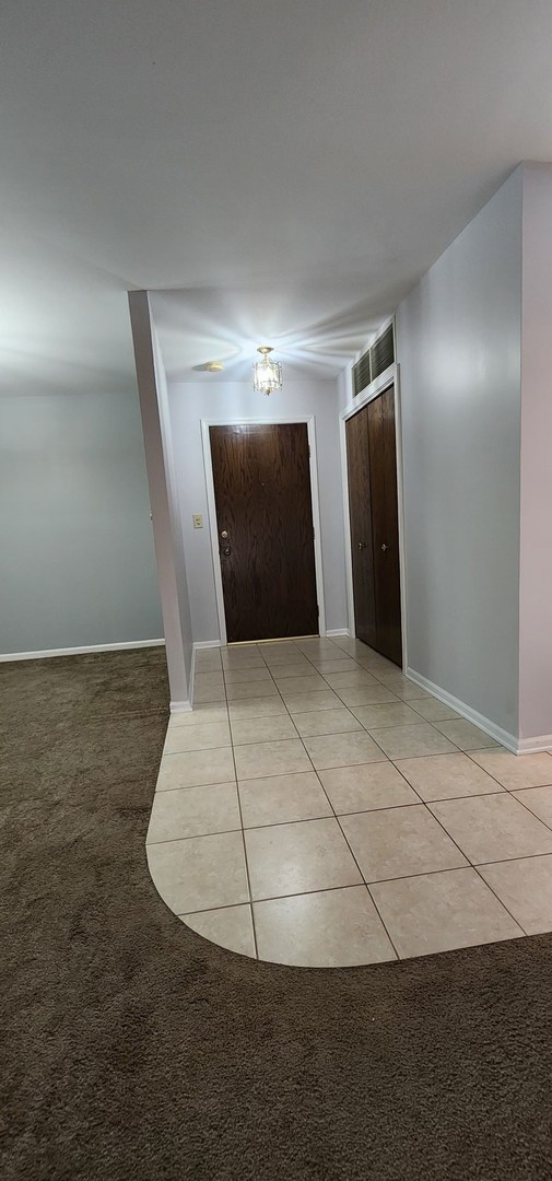 7730 Dempster Street, Unit 209 Morton Grove, IL 60053 - Photo 2 of 32 a view of an empty room