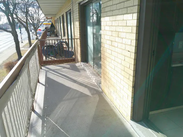 a kitchen with granite countertop a refrigerator and a stove