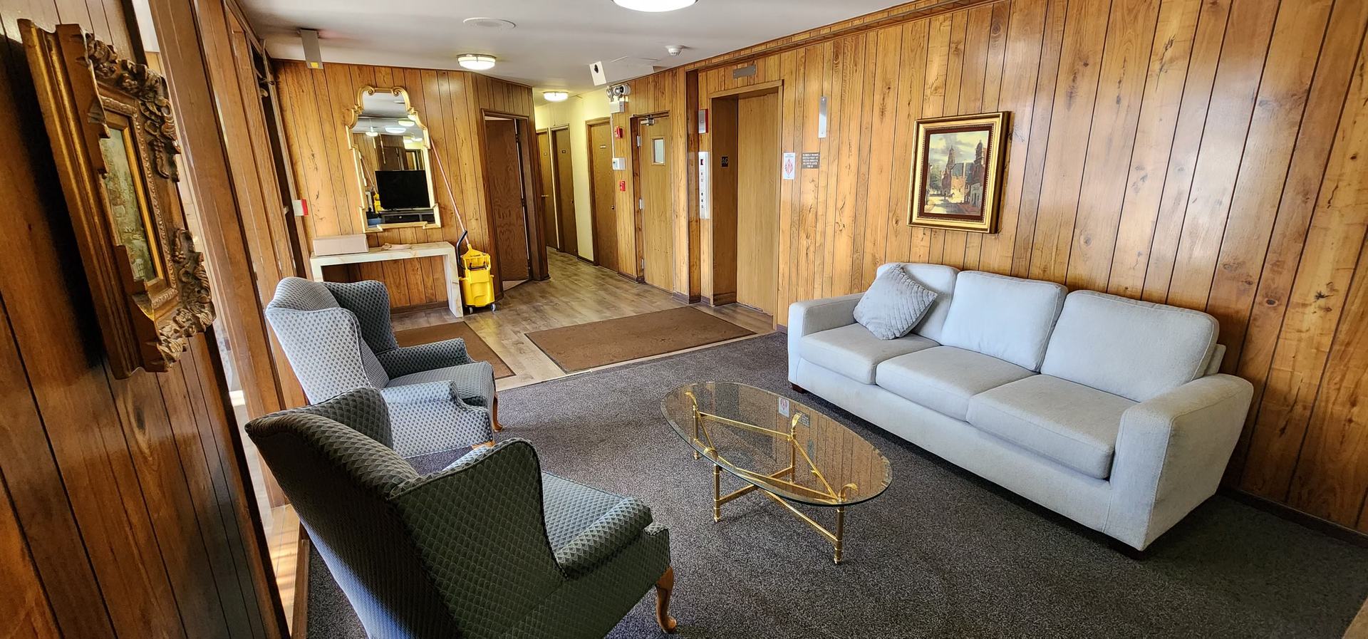 7730 Dempster Street, Unit 209 Morton Grove, IL 60053 - Photo 27 of 32 a living room with furniture and a large window