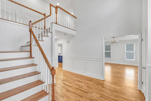 a view of a hallway view with staircase