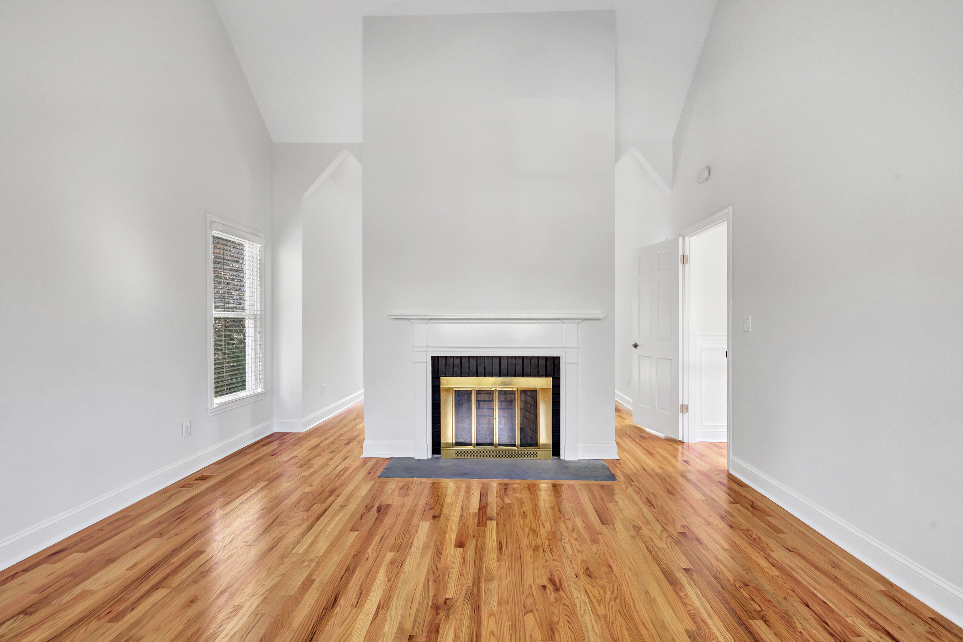93 Putting Green Road North Trumbull, CT 06611 - Photo 17 of 40 a view of an empty room with wooden floor and a window
