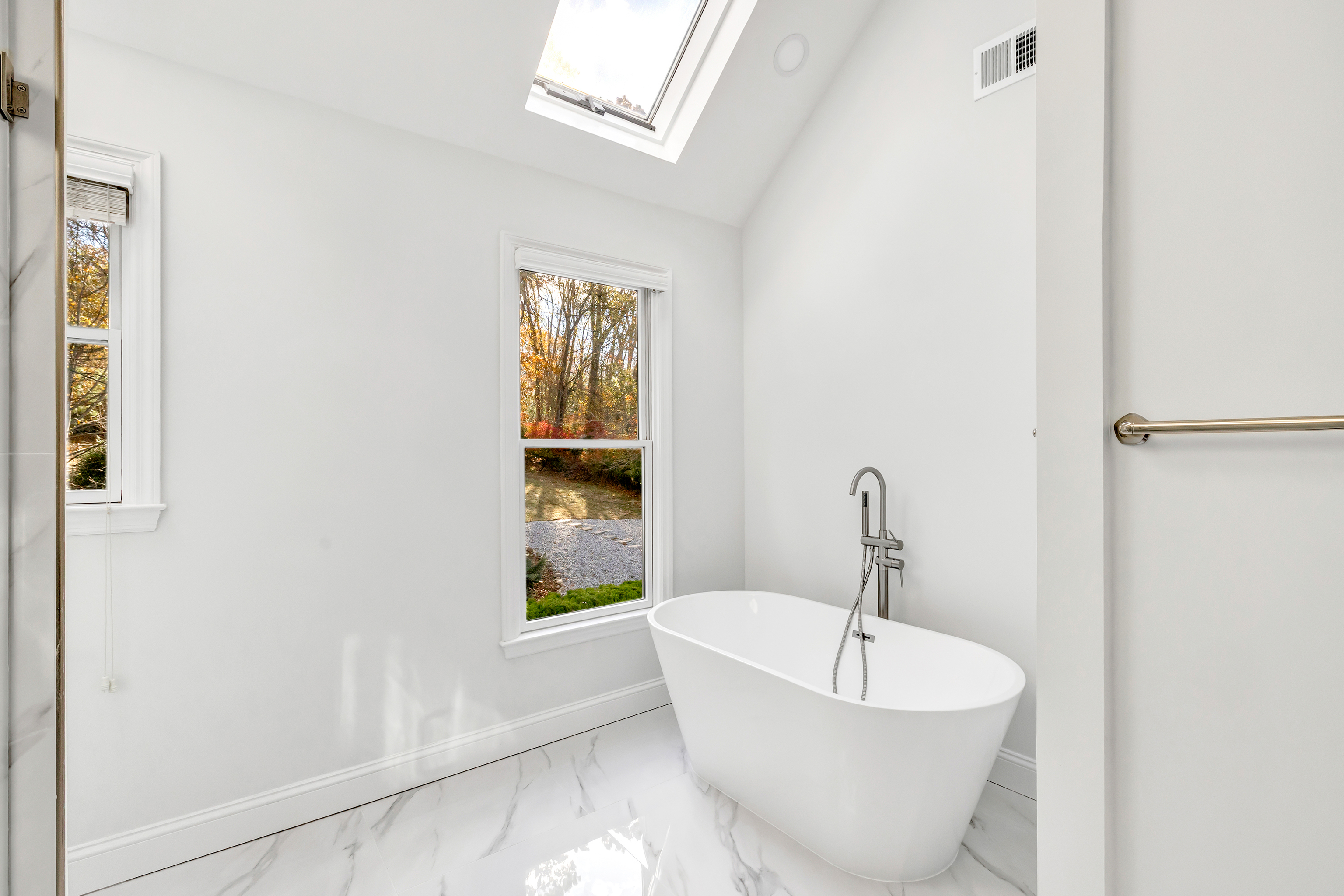 93 Putting Green Road North Trumbull, CT 06611 - Photo 23 of 40 a white bath tub sitting next to a window