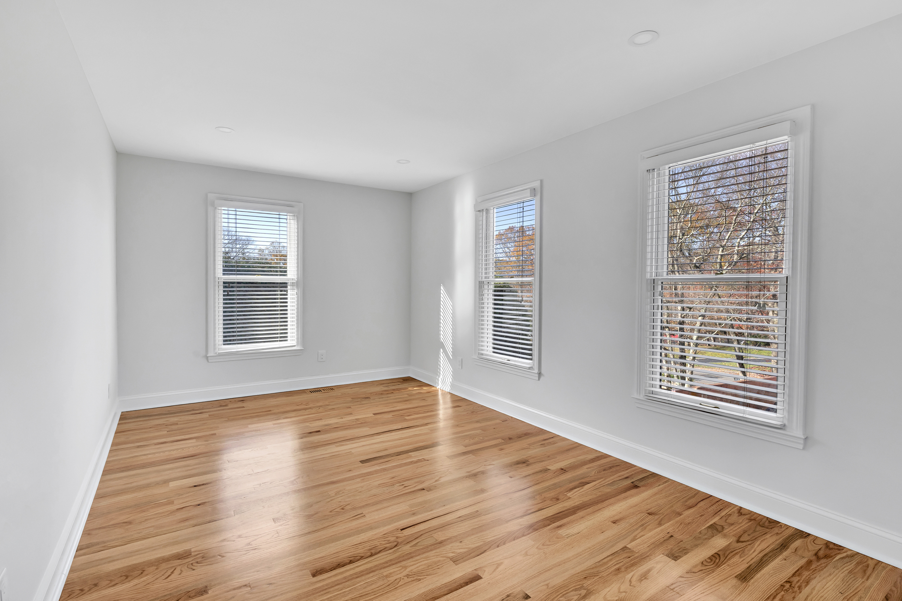 93 Putting Green Road North Trumbull, CT 06611 - Photo 25 of 40 a view of an empty room with wooden floor and a window