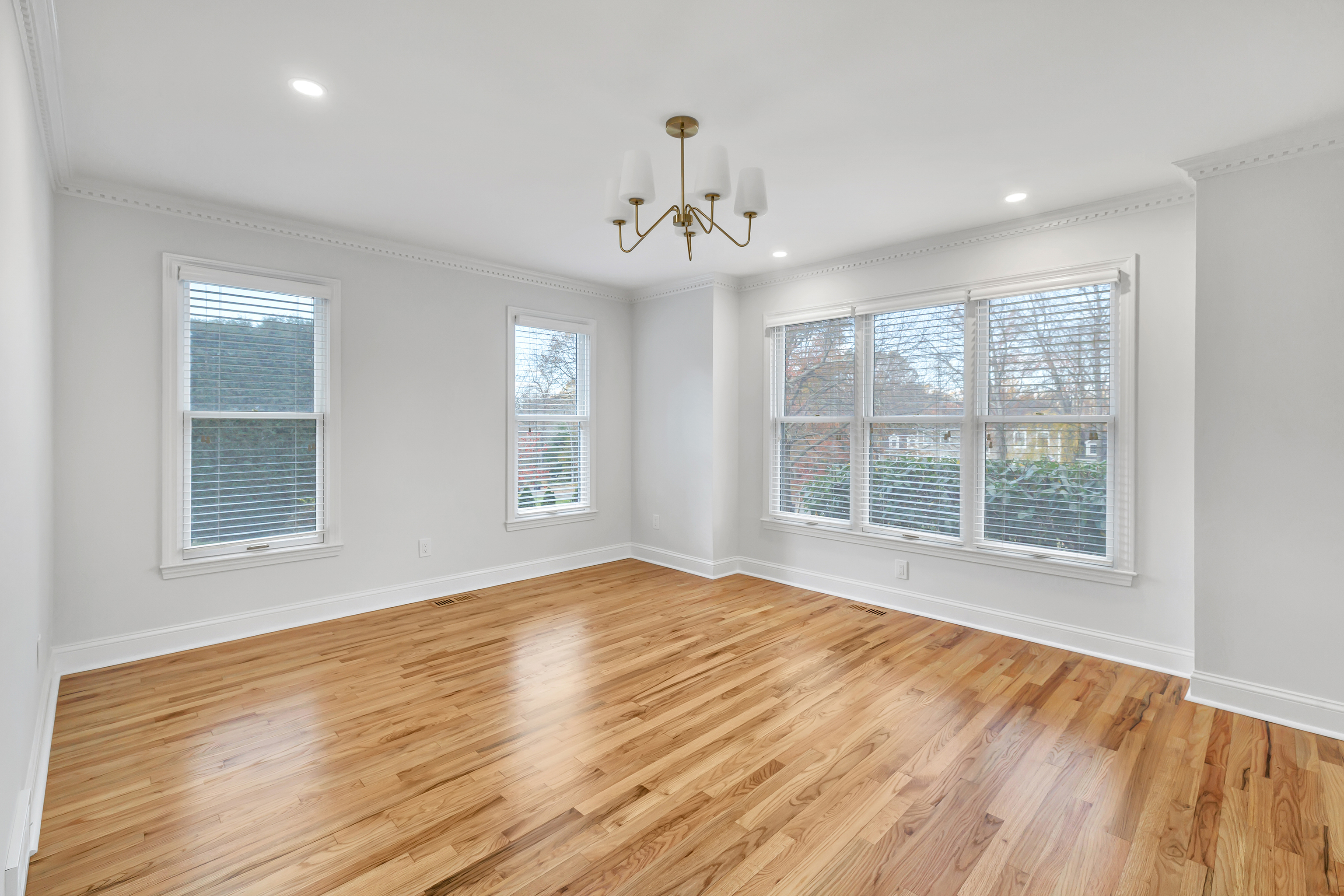 93 Putting Green Road North Trumbull, CT 06611 - Photo 27 of 40 a view of an empty room with wooden floor and a window