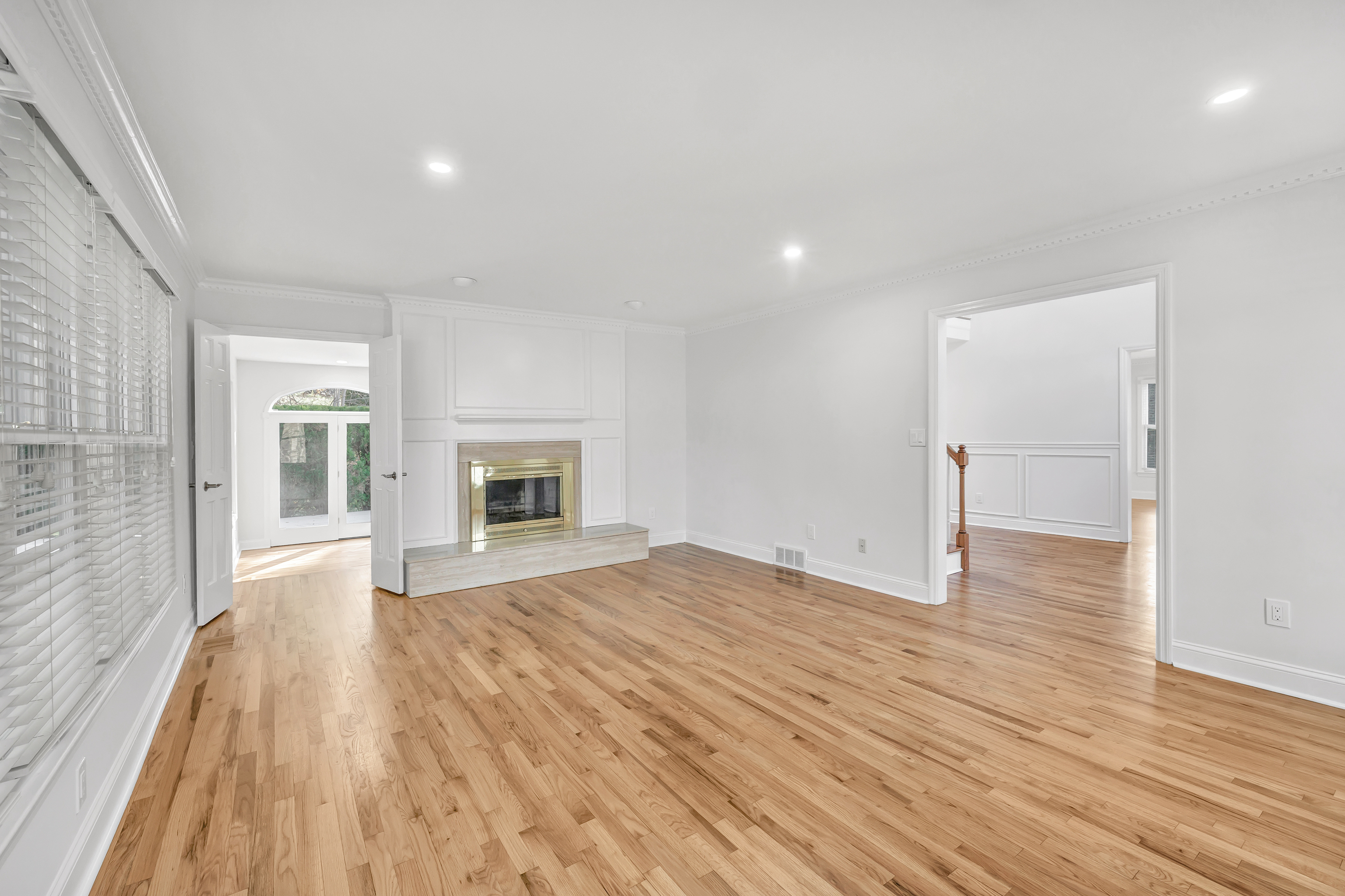 93 Putting Green Road North Trumbull, CT 06611 - Photo 5 of 40 a view of empty room with wooden floor and fireplace