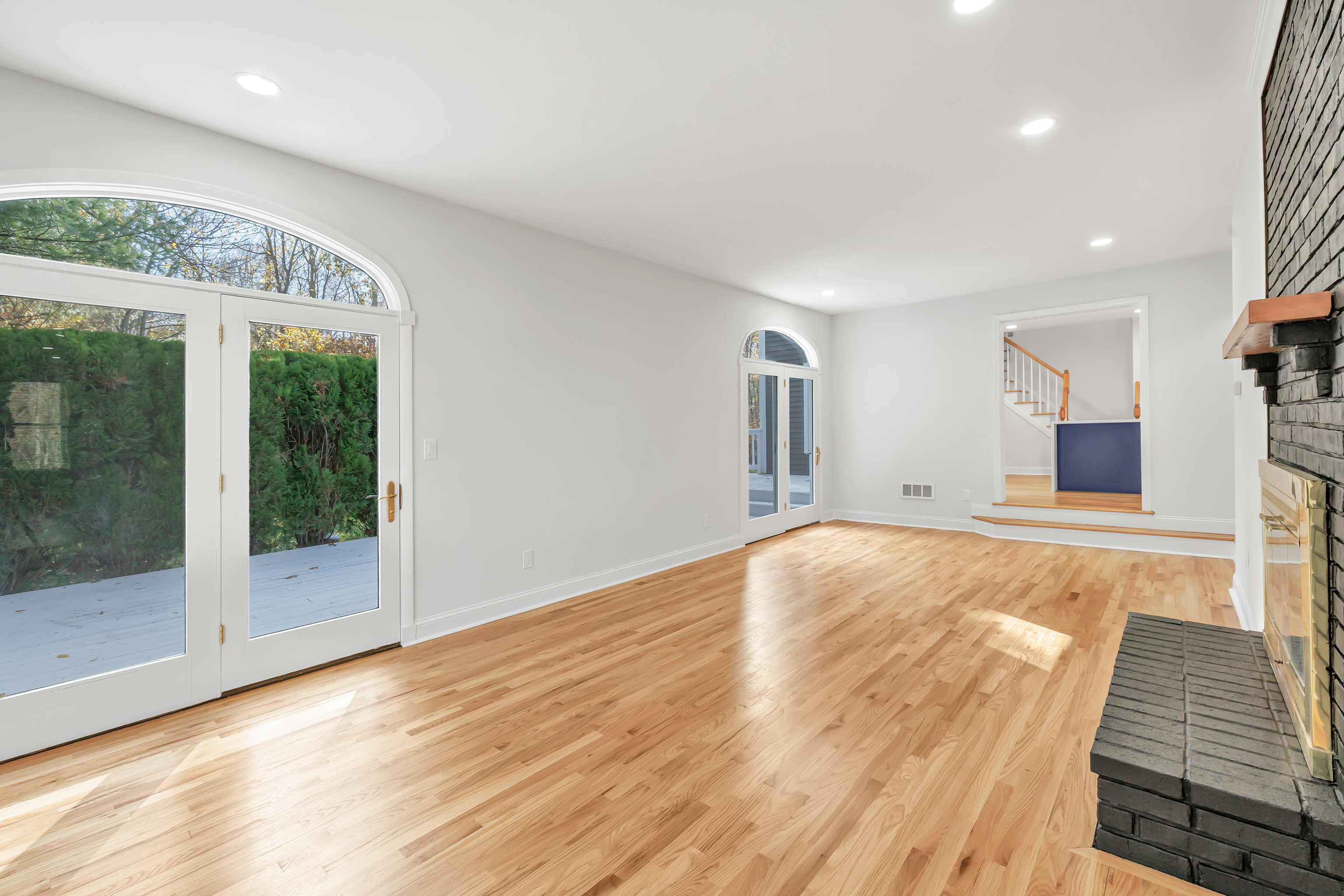 93 Putting Green Road North Trumbull, CT 06611 - Photo 7 of 40 a view of an empty room with wooden floor and a window