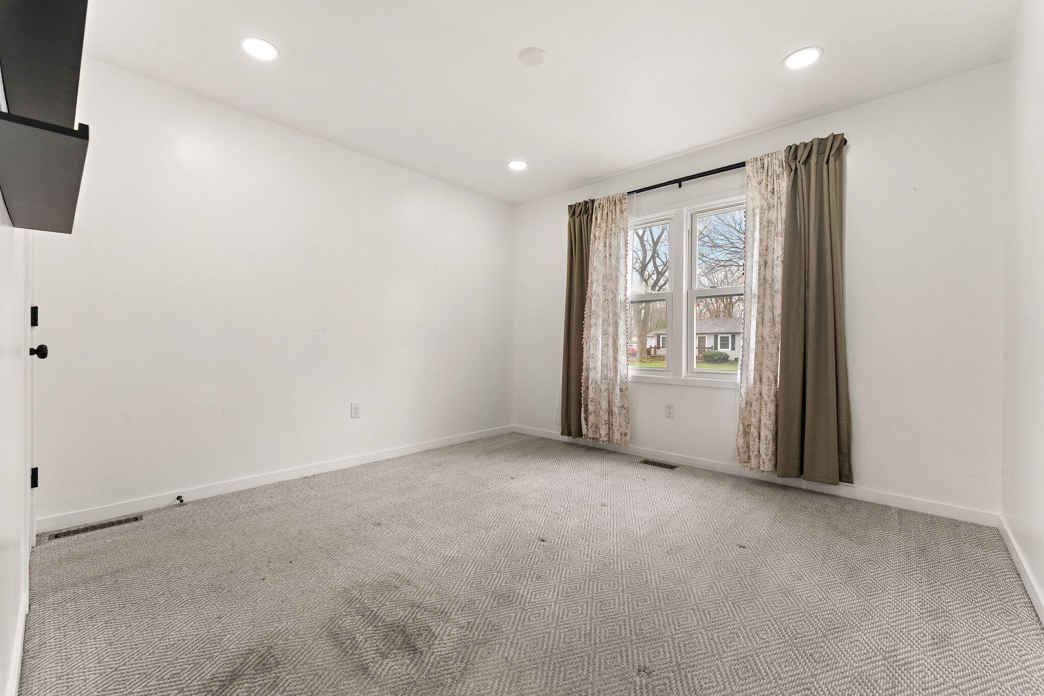 2840 Lois Street Portage, IN 46368 - Photo 20 of 22 a view of an empty room with a window