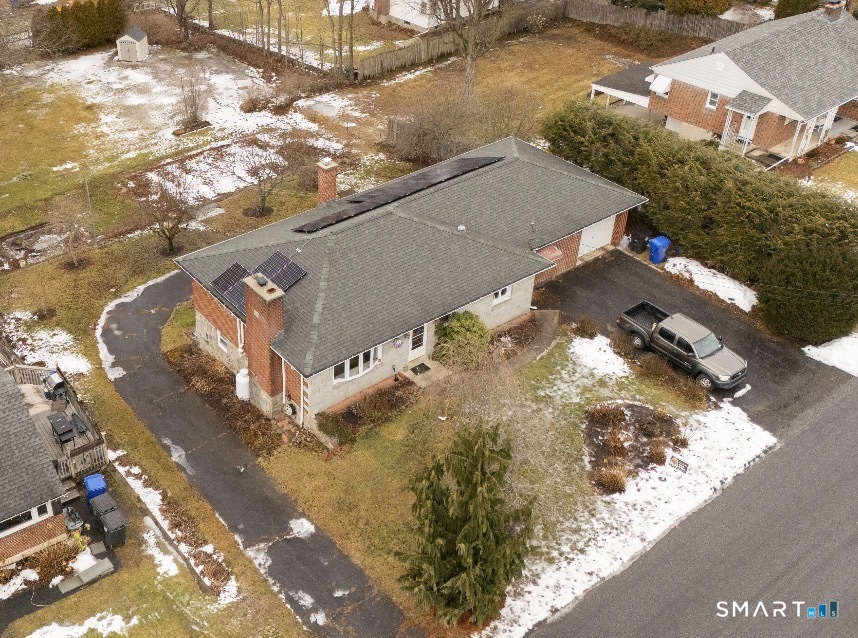 an aerial view of residential houses with outdoor space