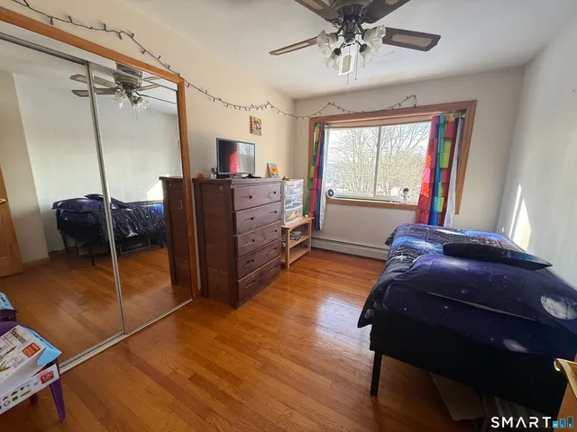 a view of entryway with wooden floor