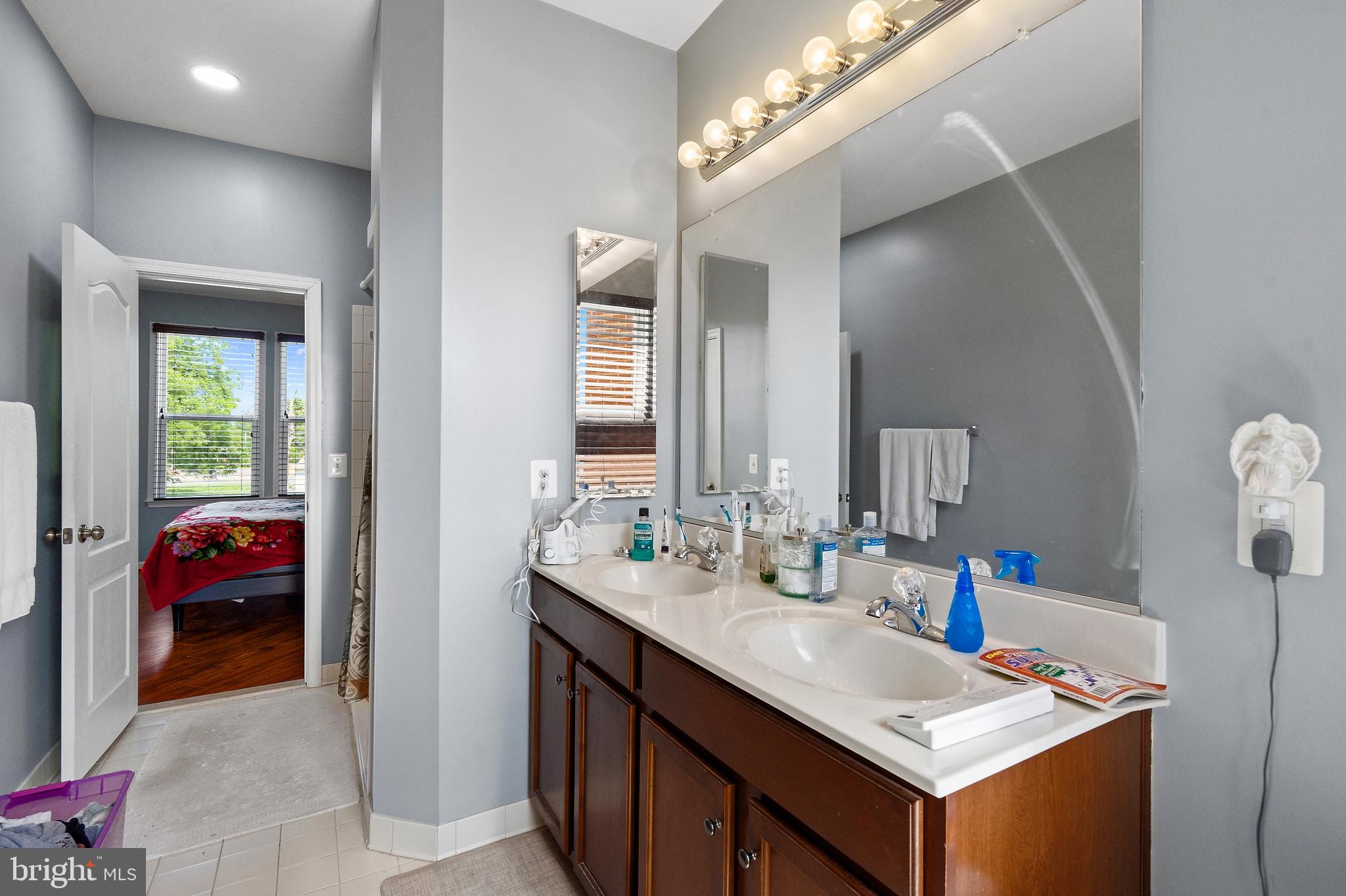 8925 Quarry Road Manassas, VA 20110 - Photo 32 of 63 Modern dual-sink bathroom oasis.