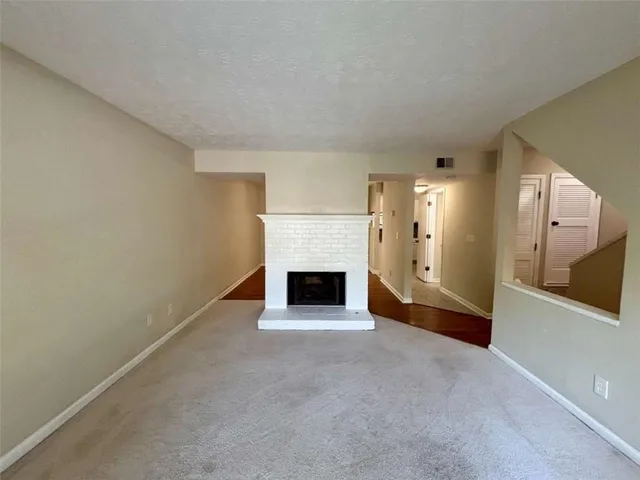 a view of a livingroom with a fireplace and a fireplace