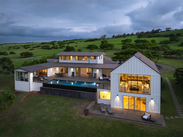 an aerial view of a house with a garden