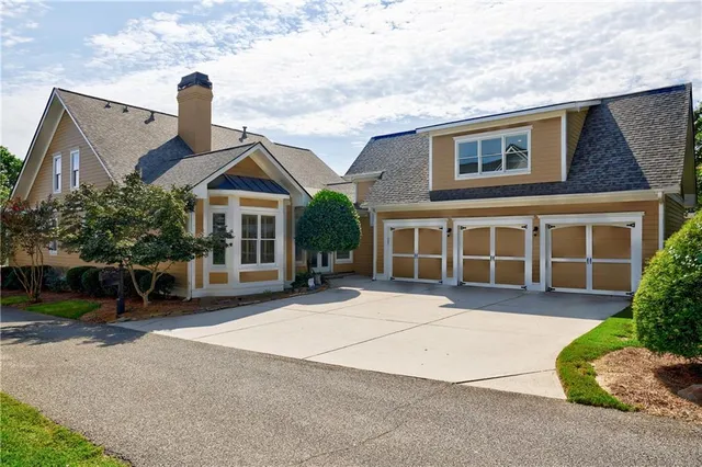 a living room with furniture ceiling fan and a rug