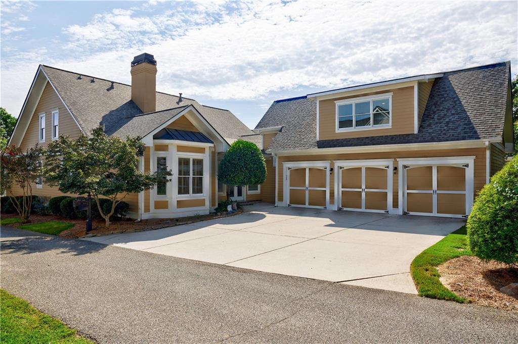 2370 Muskogee Lane Braselton, GA 30517 - Photo 5 of 27 front view of a house with a garden