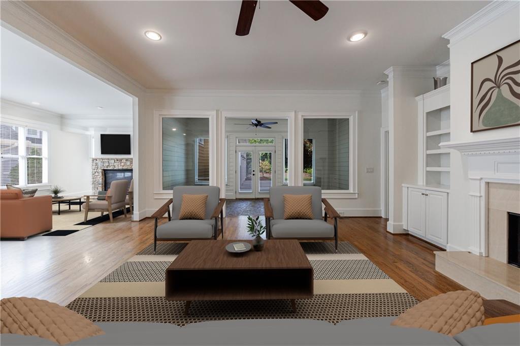 2370 Muskogee Lane Braselton, GA 30517 - Photo 7 of 27 a living room with furniture ceiling fan and a rug
