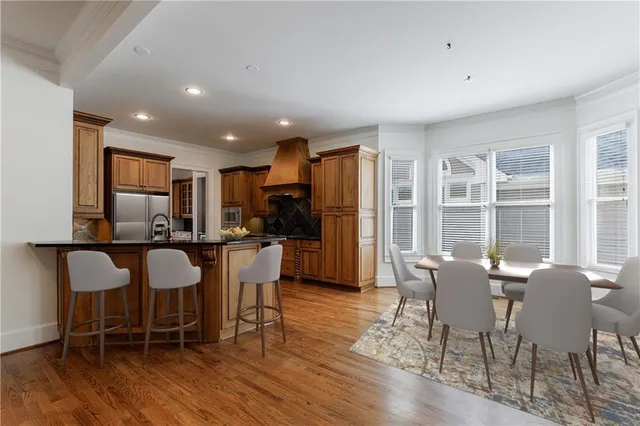 a spacious bedroom with a bed and a chandelier
