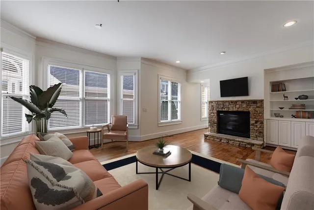 a kitchen with kitchen island granite countertop wooden cabinets and refrigerator