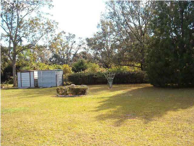 121 Majors Road Pensacola, FL 32503 - Photo 8 of 9 Another view of back yard and storage buildings