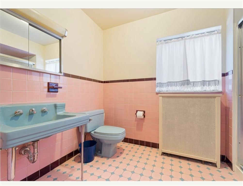 4745 Friendship Avenue Pittsburgh, PA 15224 - Photo 13 of 25 a bathroom with a sink toilet and shower