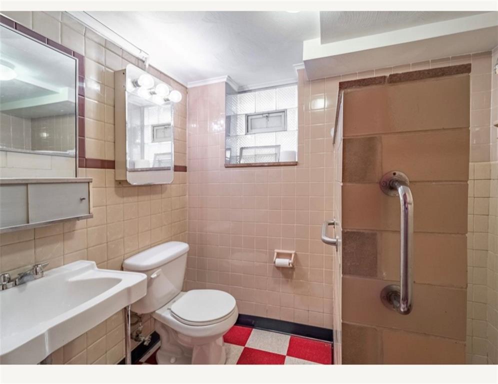 4745 Friendship Avenue Pittsburgh, PA 15224 - Photo 18 of 25 a bathroom with a toilet a sink and shower