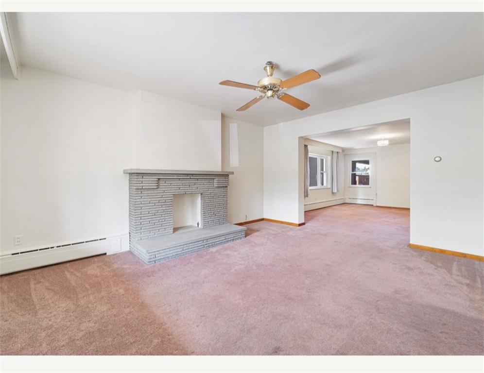 4745 Friendship Avenue Pittsburgh, PA 15224 - Photo 4 of 25 a view of empty room with fan and a fireplace