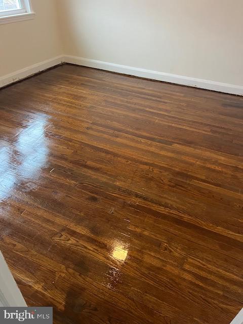1930 Frames Road Dundalk, MD 21222 - Photo 4 of 5 a view of an empty room with wooden floor