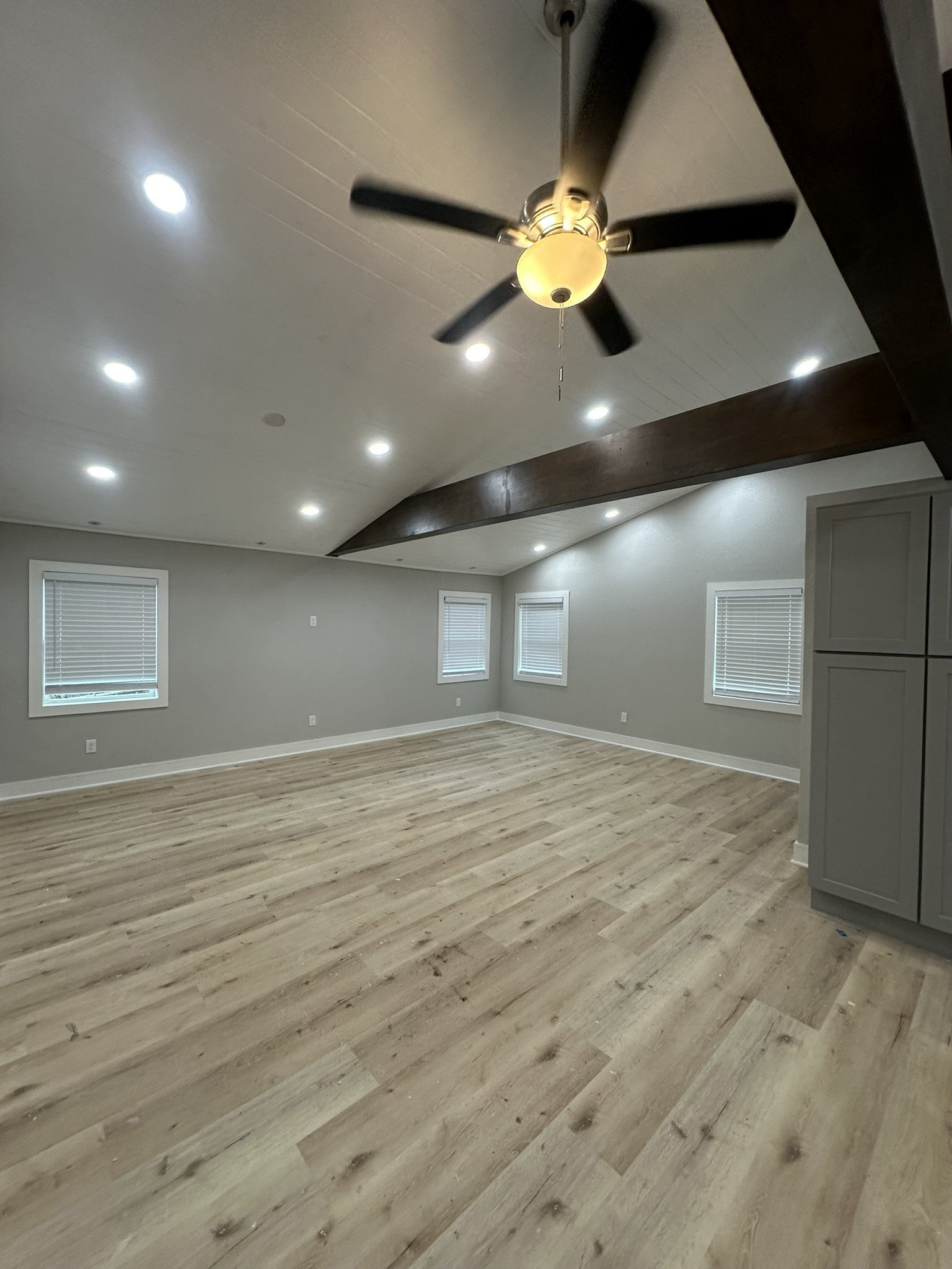 8223 Wallis Street Fulshear, TX 77441 - Photo 15 of 30 a view of an empty room with wooden floor