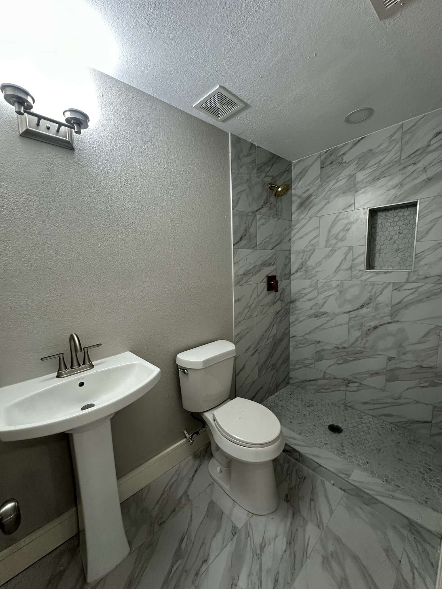 8223 Wallis Street Fulshear, TX 77441 - Photo 29 of 30 a bathroom with a sink a toilet and shower