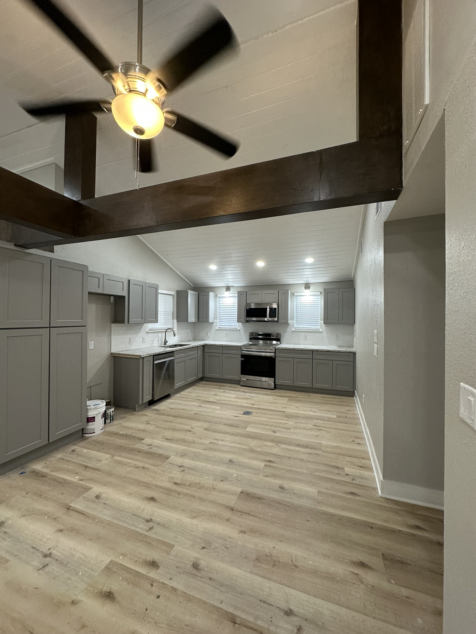 8223 Wallis Street Fulshear, TX 77441 - Photo 10 of 30 a view of a kitchen with a sink and chandelier