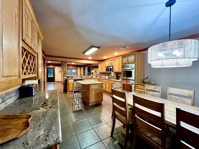 a kitchen with a stove sink and microwave