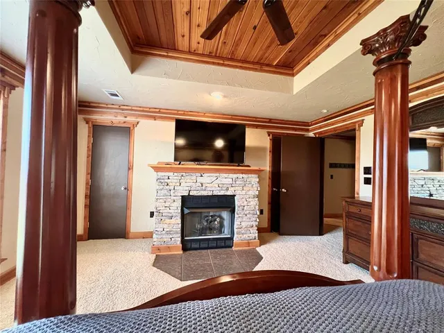 a bedroom with furniture and a large window