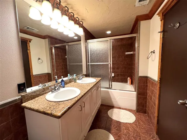 a bed room with a bed and a television