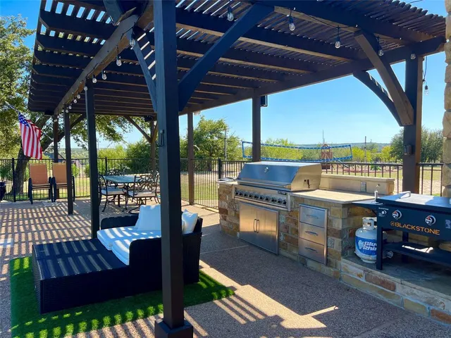 a view of yard with swimming pool and trees