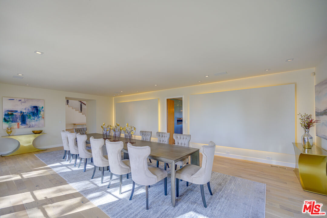 1235 Tower Road Beverly Hills, CA 90210 - Photo 12 of 31 a view of a dining room with furniture and wooden floor