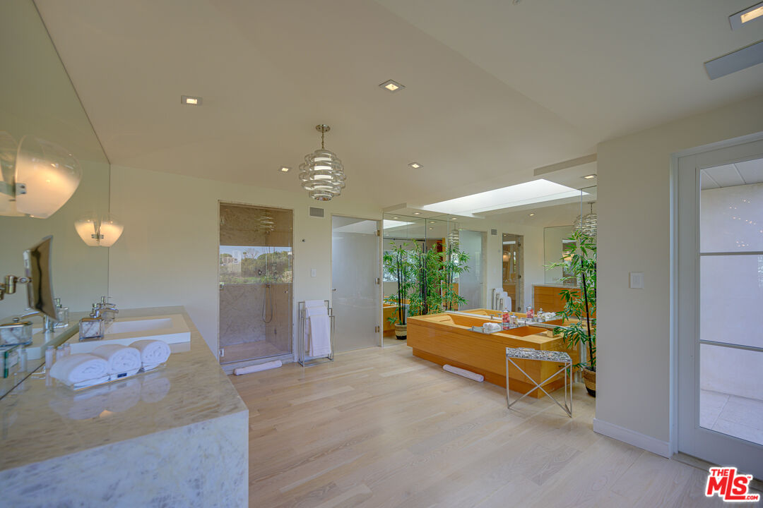 1235 Tower Road Beverly Hills, CA 90210 - Photo 21 of 31 a living room with furniture and a large window