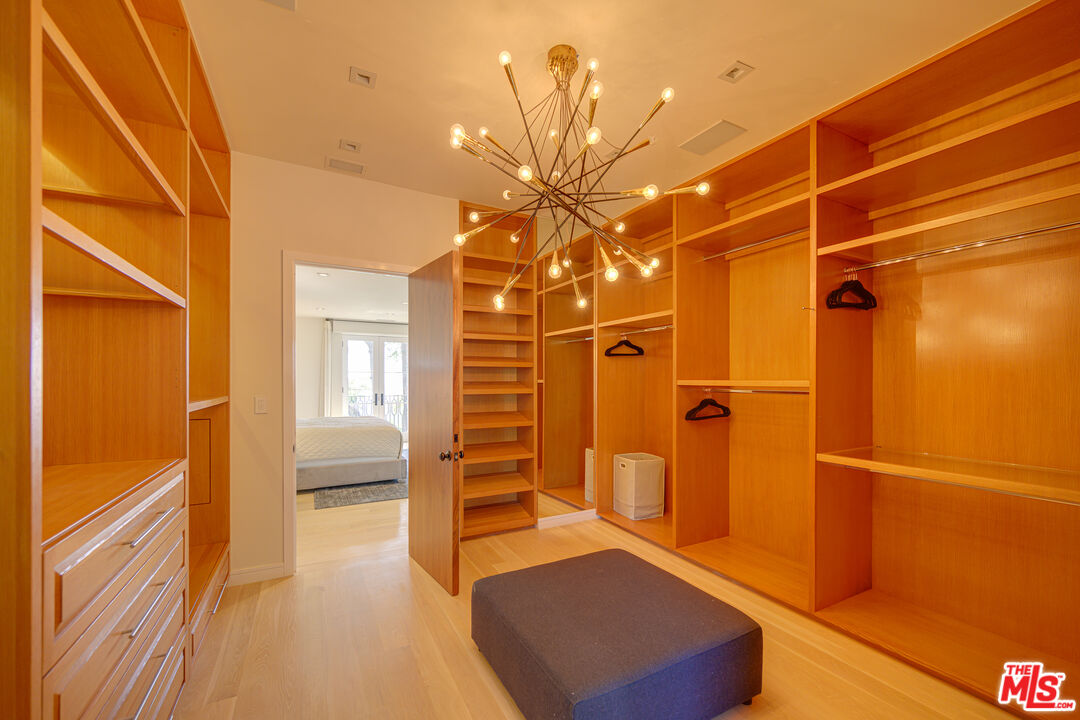 1235 Tower Road Beverly Hills, CA 90210 - Photo 22 of 31 a view of walk in closet with empty racks