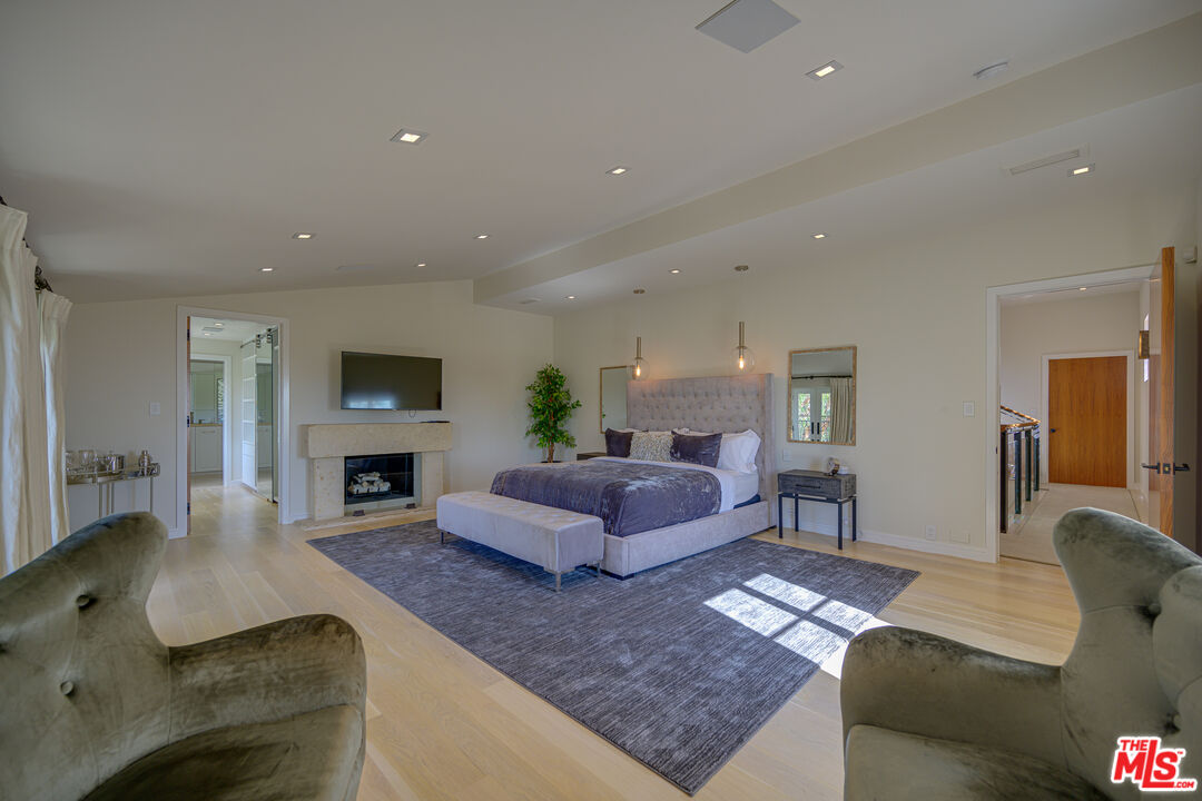 1235 Tower Road Beverly Hills, CA 90210 - Photo 23 of 31 a living room with furniture and a fireplace