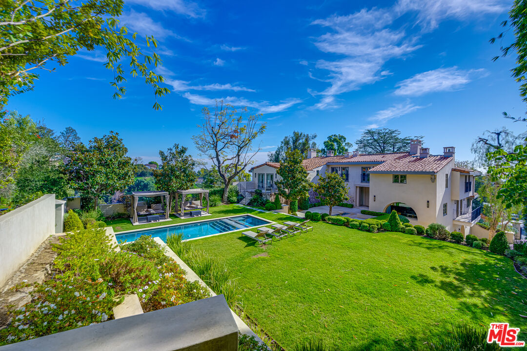 1235 Tower Road Beverly Hills, CA 90210 - Photo 28 of 31 a view of a house with a backyard