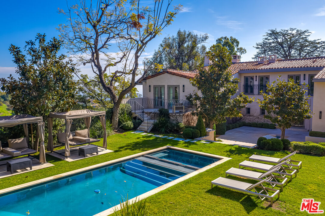 1235 Tower Road Beverly Hills, CA 90210 - Photo 31 of 31 a view of a house with pool yard and a patio