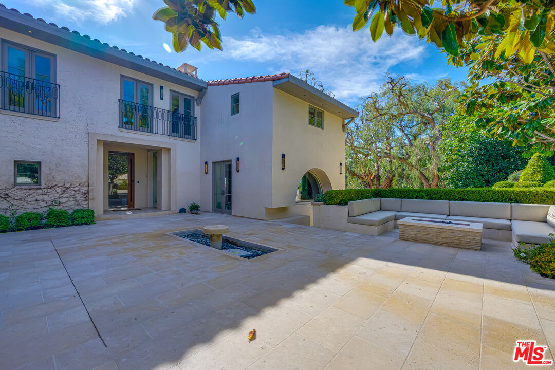 1235 Tower Road Beverly Hills, CA 90210 - Photo 4 of 31 a view of a house with backyard and plants