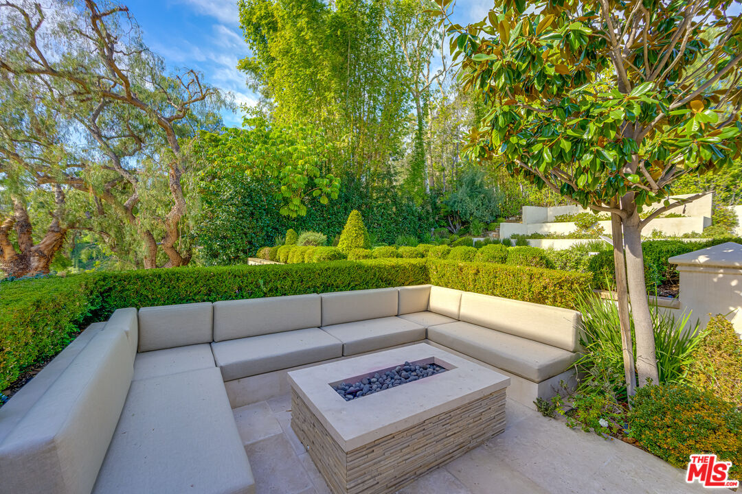 1235 Tower Road Beverly Hills, CA 90210 - Photo 5 of 31 a view of a back yard with a patio