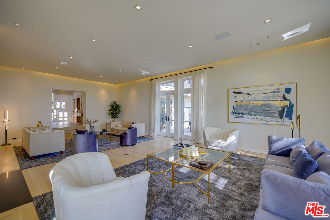 1235 Tower Road Beverly Hills, CA 90210 - Photo 8 of 31 a living room with furniture or couch and a potted plant