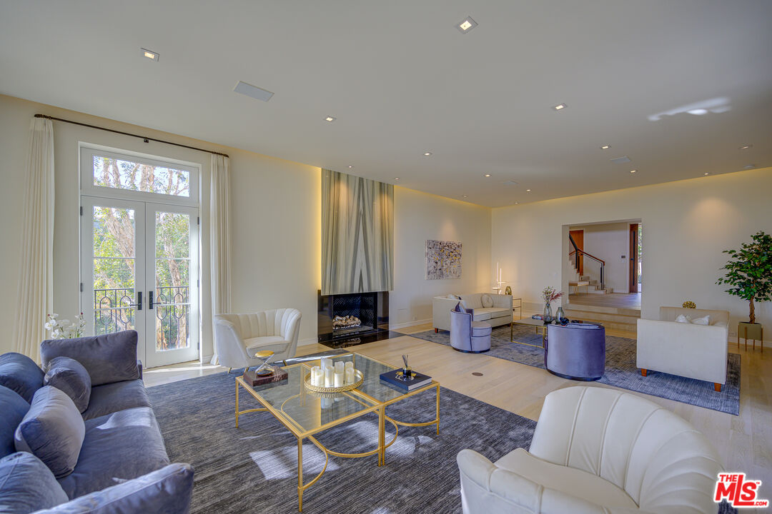 1235 Tower Road Beverly Hills, CA 90210 - Photo 9 of 31 a living room with furniture or couch and a wooden floor